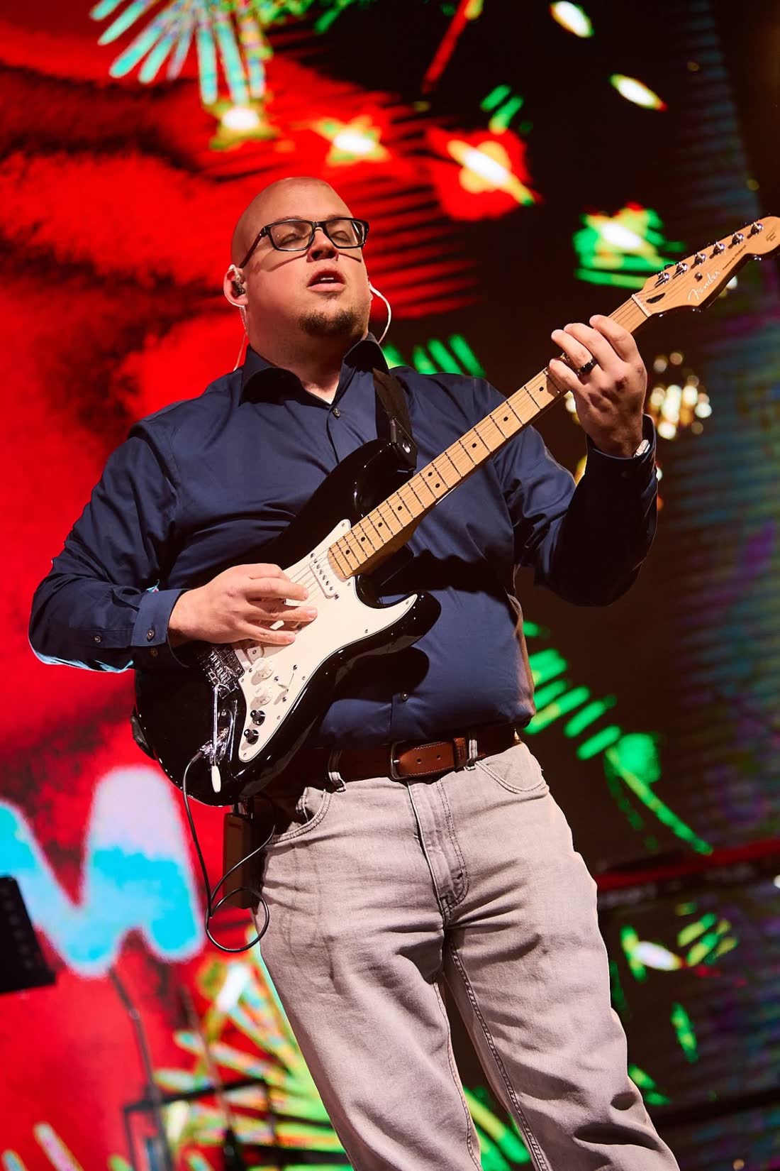 Frank Torres playing guitar, eyes closed